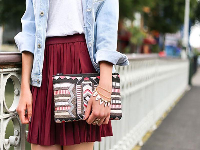 Distressed A-line jean skirt with frayed hemlines